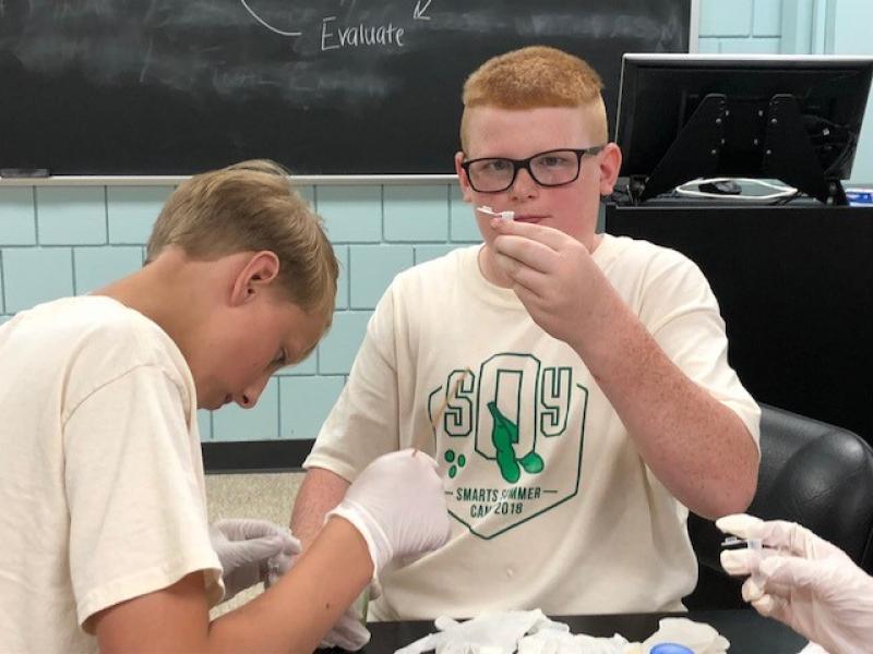 Students at the Soy Smarts Camp extract DNA from applesauce