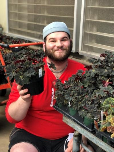 JL (Jordan) Hartman holding a BLMbegonia