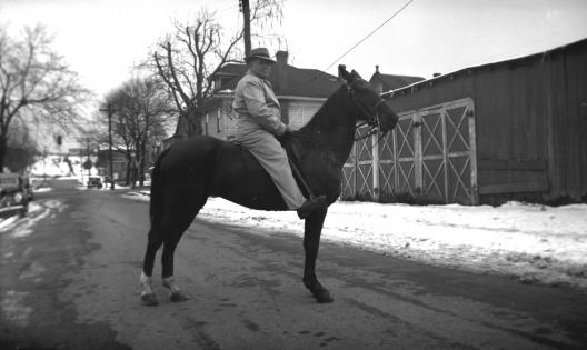 William Dixon, an iceman, on a horse he used to pull the icecart