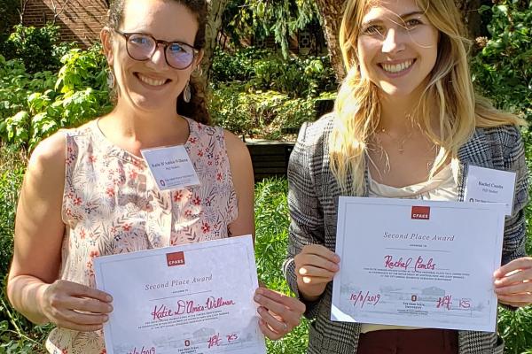 TPS Fellows Katie D'Amico-Willman and Rachel Combs hold their certificates after placing second in the Horticulture and Crop Science Graduate Research Symposium.